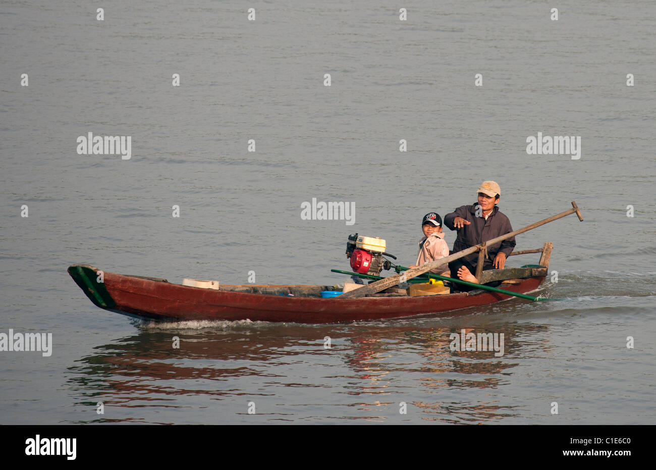 Father and Son in a Small Boat on the Saigon River Stock Photo