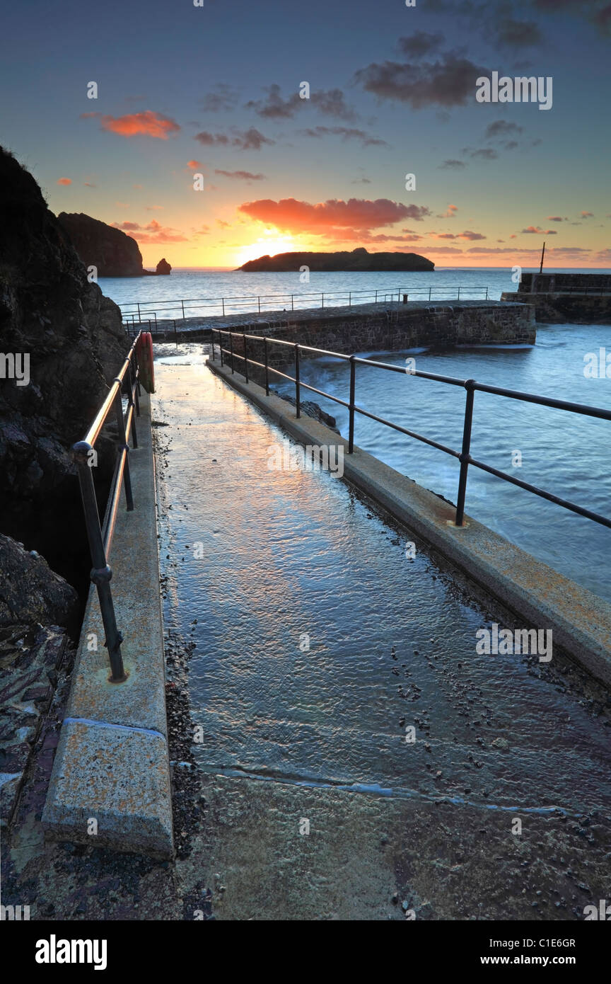 Mullion Harbour in Cornwall captured at sunset Stock Photo