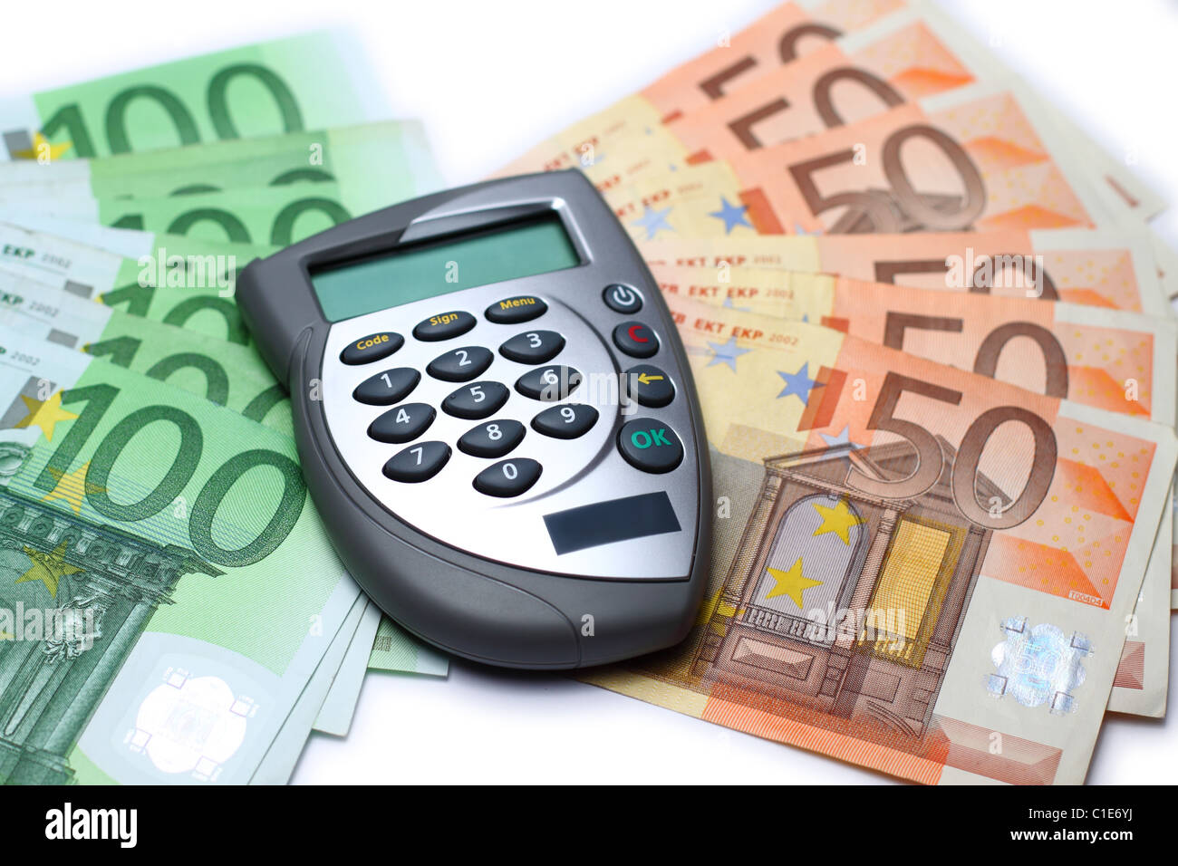 Bank card reader, Internet banking authorization device lying on some euro bills Stock Photo