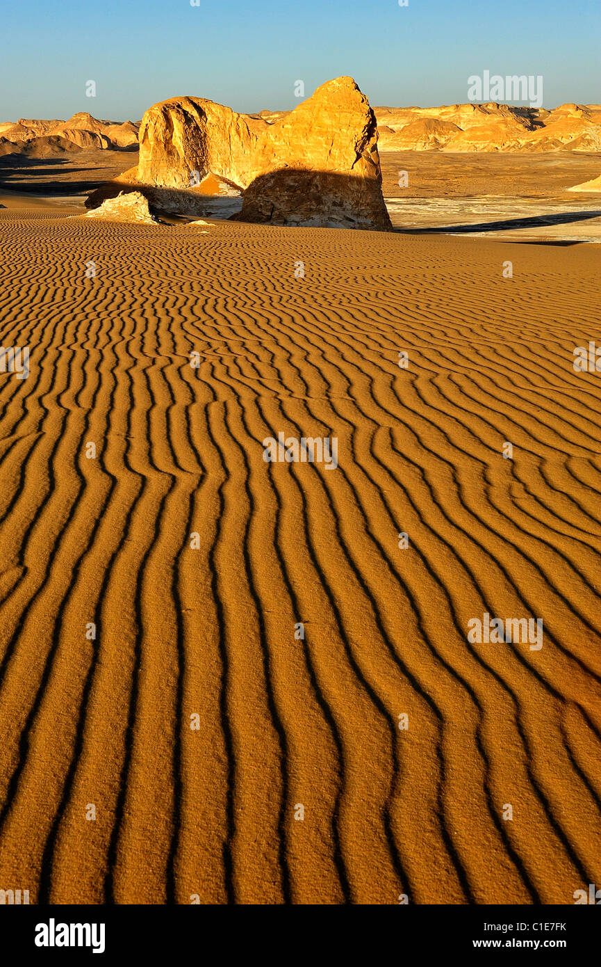 Eroded rock formations and sand dunes in the Aqabat area, White Desert National Park, western of Egypt Stock Photo