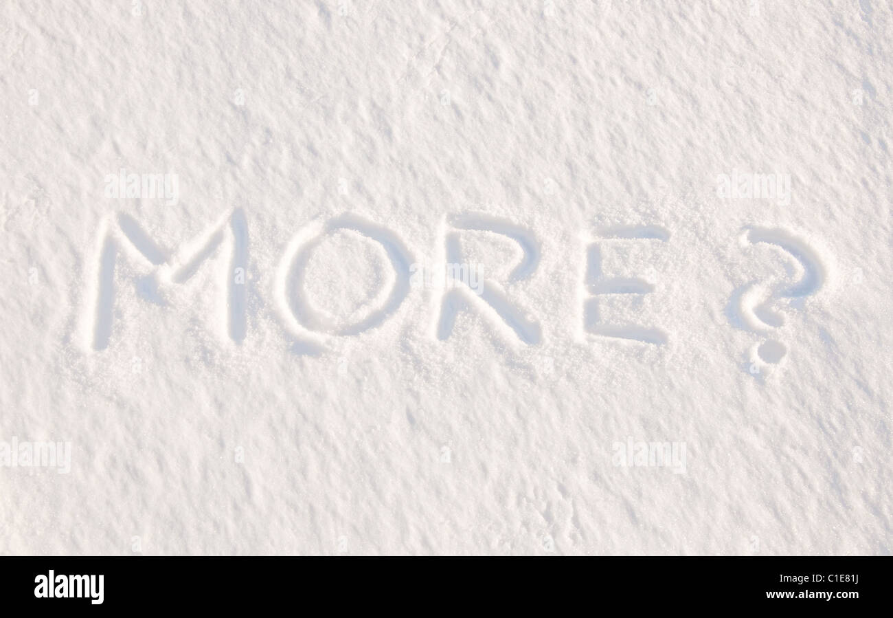 More? - written in snow, concept of being tired of cold weather and snow Stock Photo