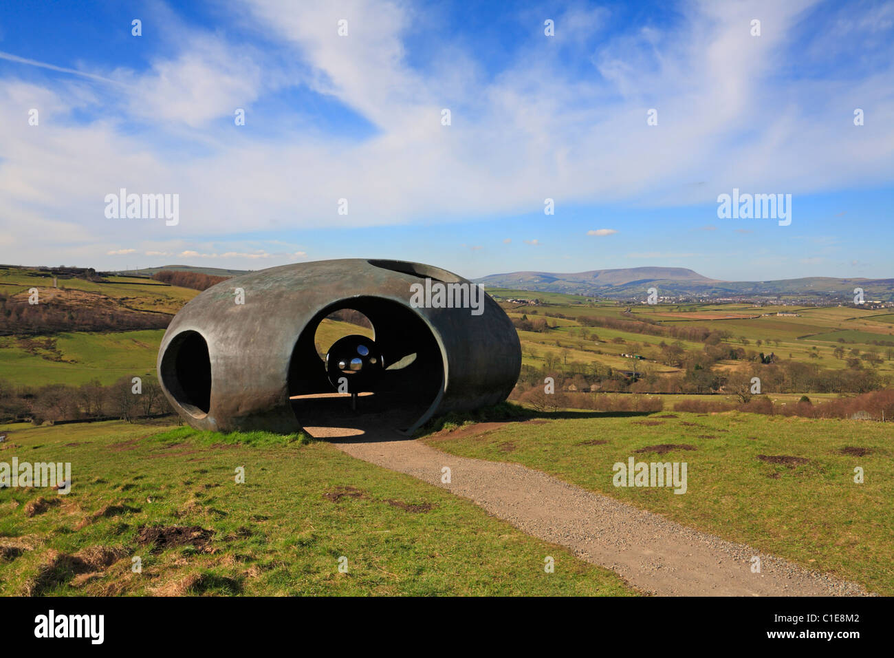 Atom Panopticon sculpture with Pendle Hill in the distance, Wycoller Country Park, Colne, Pendle, Lancashire, England, UK. Stock Photo