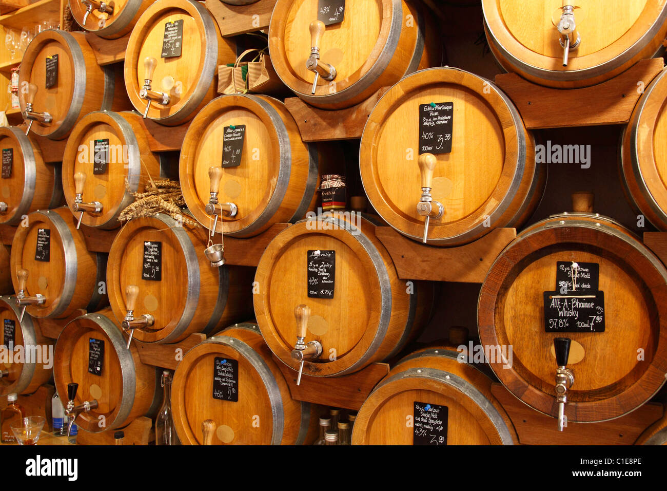 whiskey barrels in a store Stock Photo Alamy