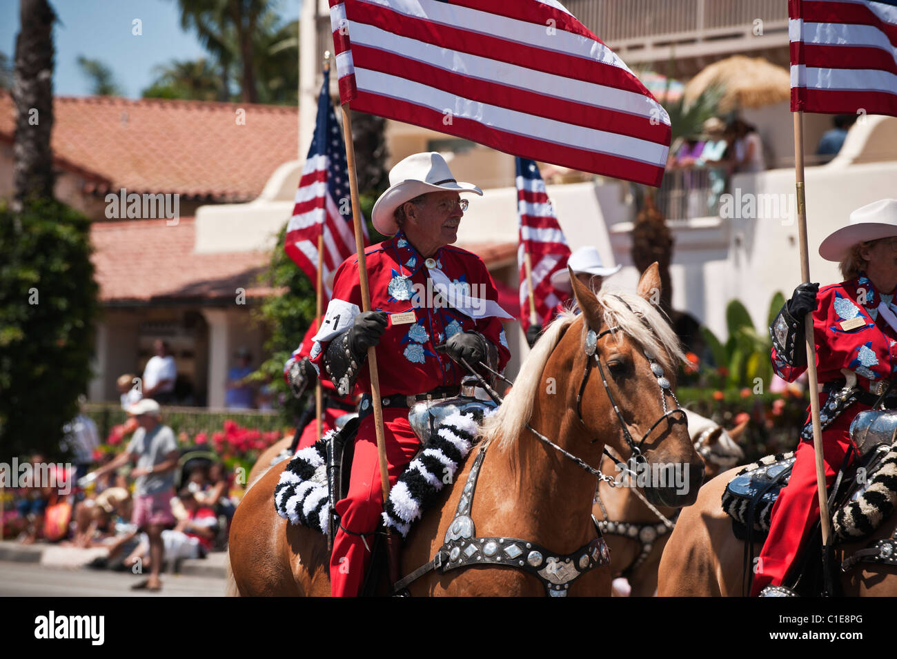Horse riders with flags in Fiesta parade, Santa Barbara, California