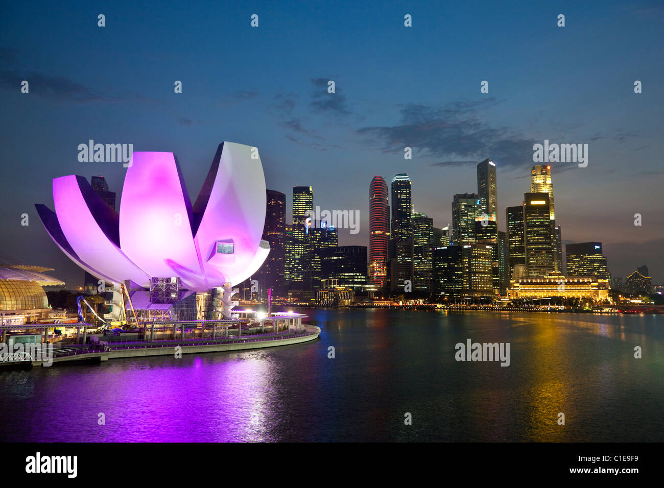 The ArtScience Museum at Marina Bay Sands with city skyline in background.  Marina Bay, Singapore. Stock Photo