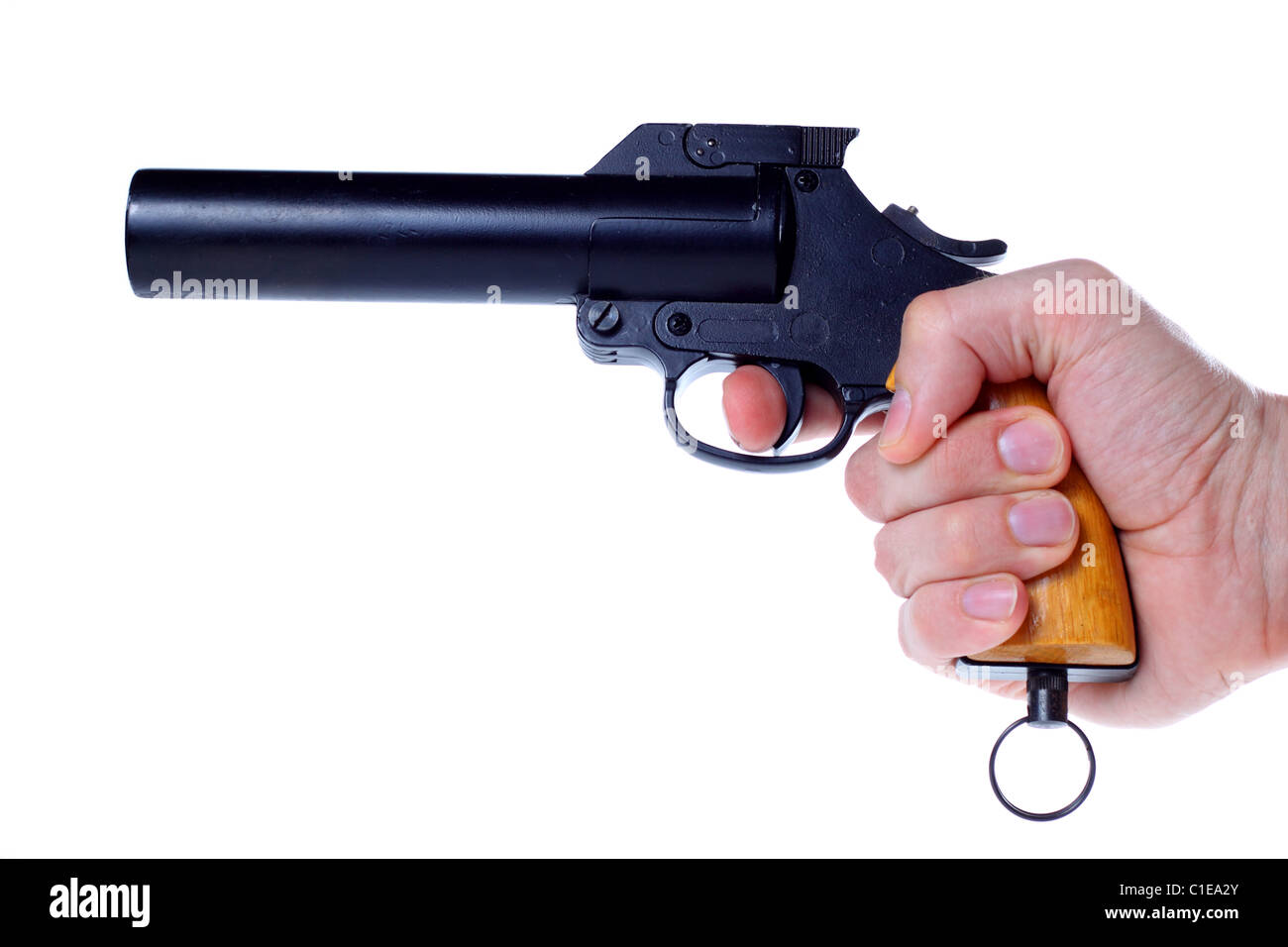 Flare gun aimed cocked in right hand Stock Photo