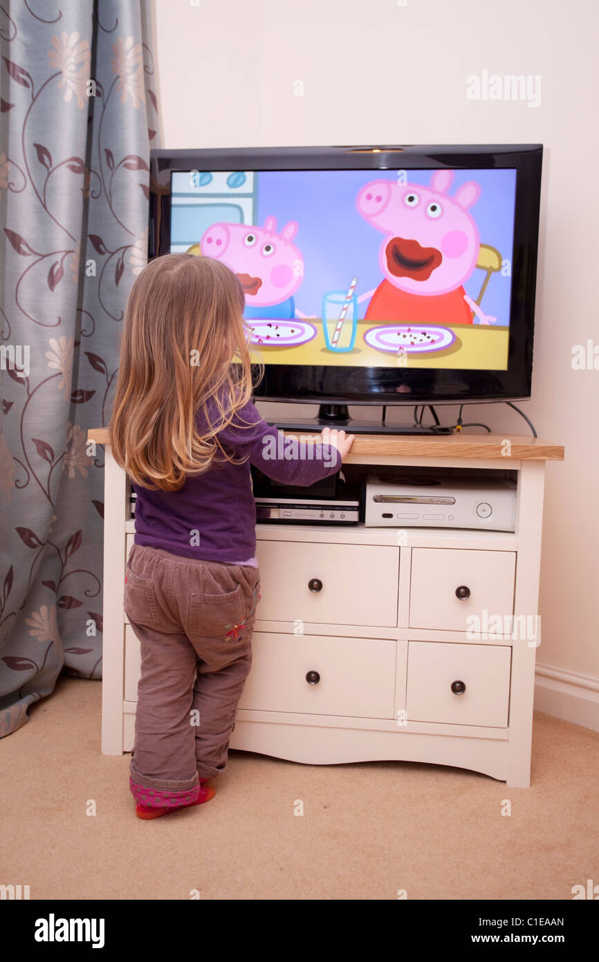 female toddler watching television Stock Photo