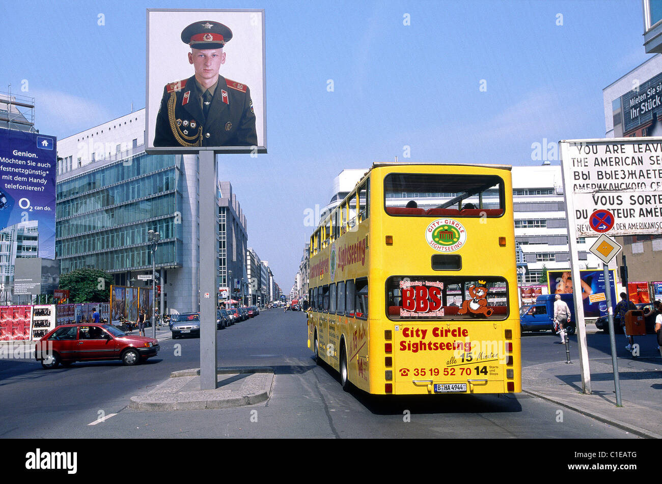 Germany Berlin Checkpoint Charlie former passage between the East & the West at the time of the Wall double decker excursion bus Stock Photo
