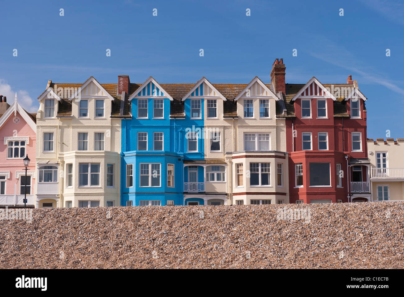 A row of colourful bay fronted houses on the seafront in Aldeburgh , Suffolk , England , Britain , Uk Stock Photo