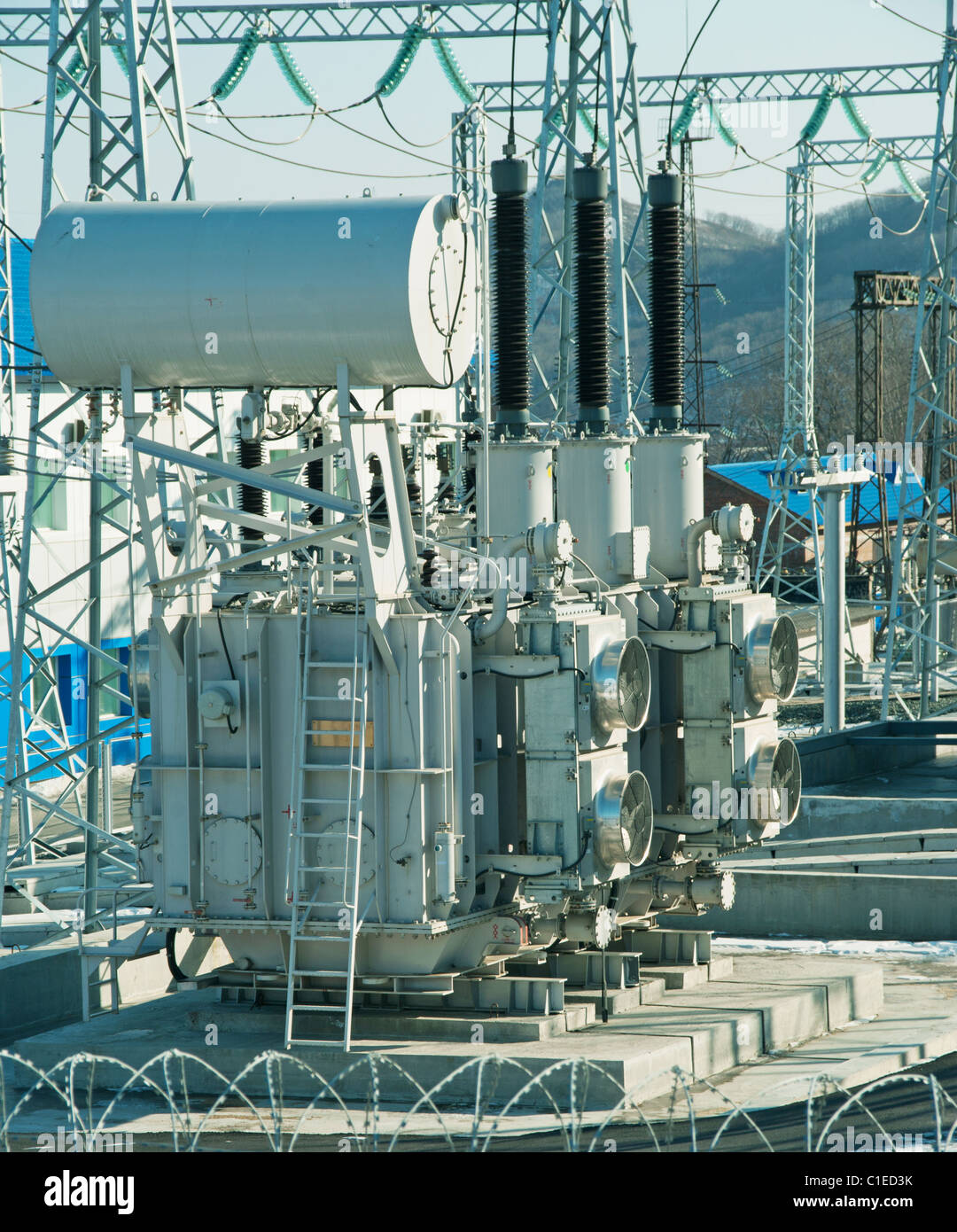 a hight voltage powerplant transformer on a switchyard Stock Photo
