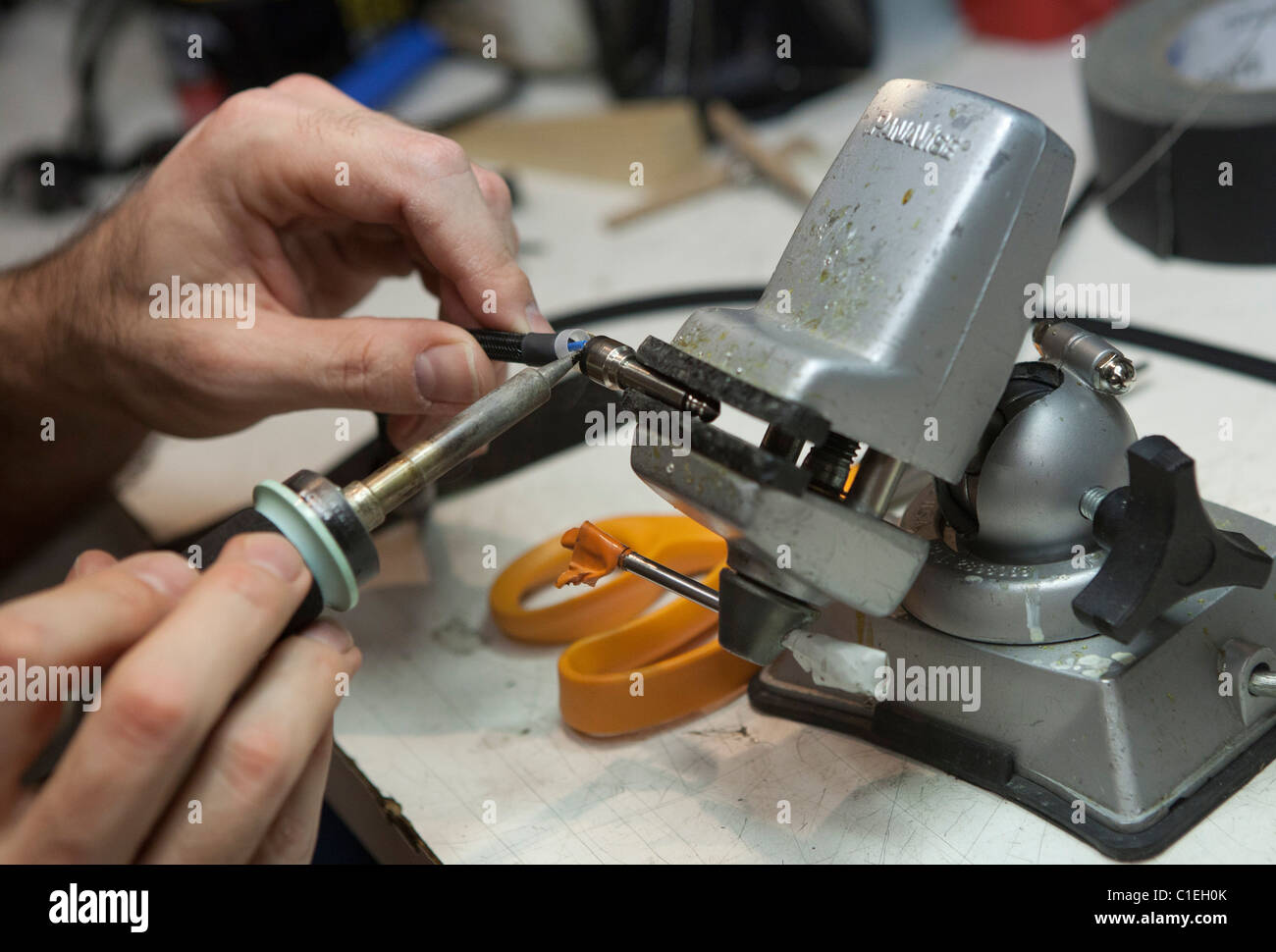 Soldering a quarter inch connector onto a guitar cable Stock Photo Alamy