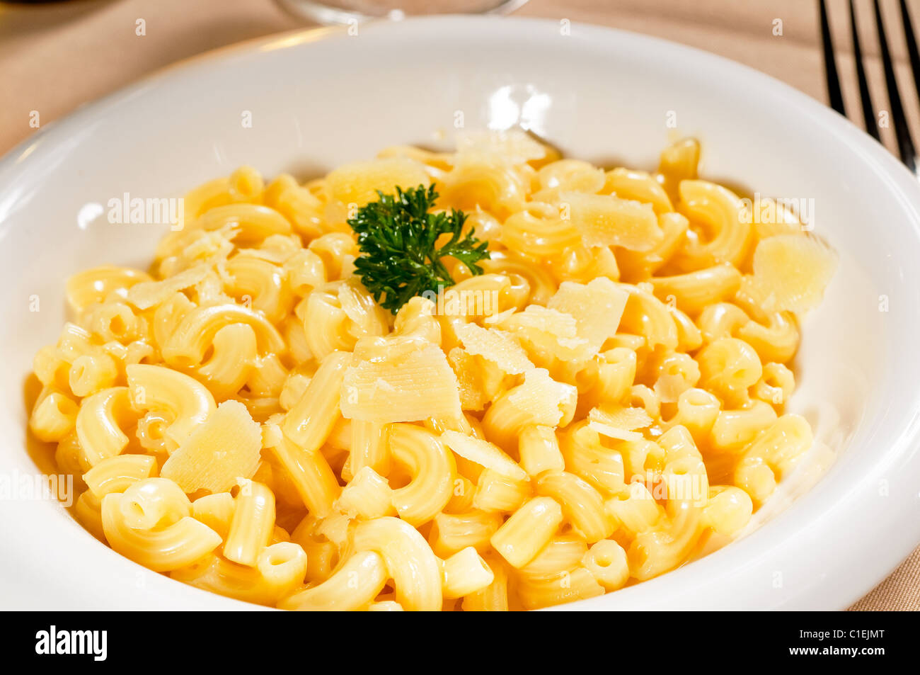 fresh original american style macaroni and cheese with parsley on top ,tipycal american food Stock Photo