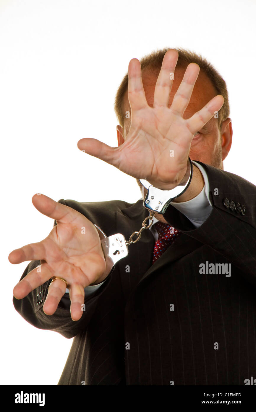 Manager for economic crime arrested handcuffed Stock Photo