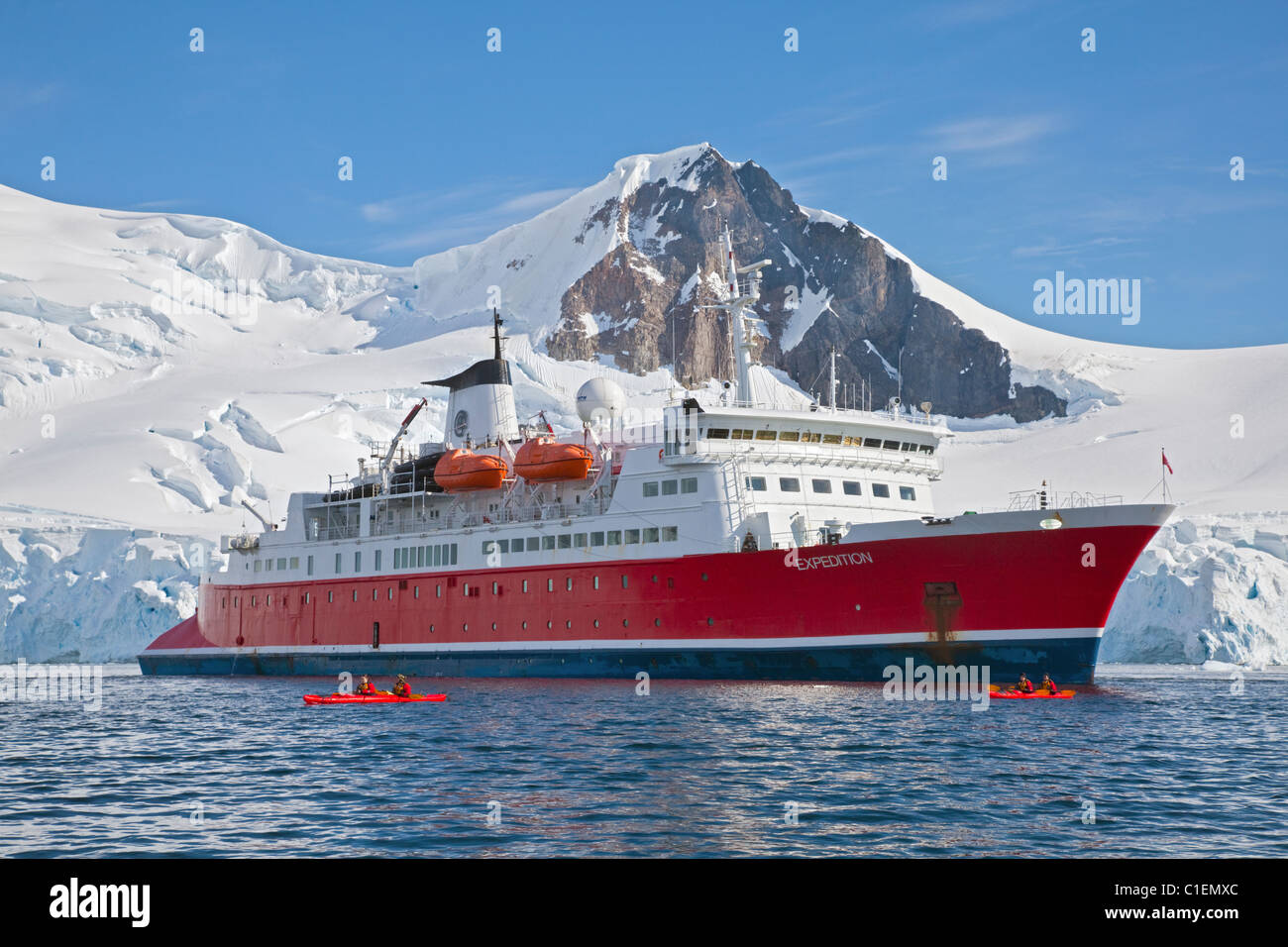 MS Expedition and Kayaks in the Lemaire Channel, Antarctic Peninsula Stock Photo