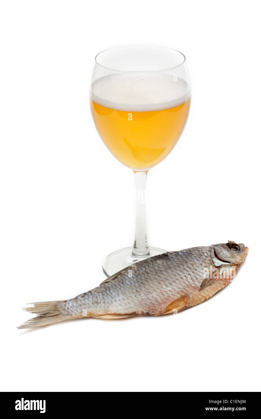Goblet beer and dried fish insulated on white background Stock Photo