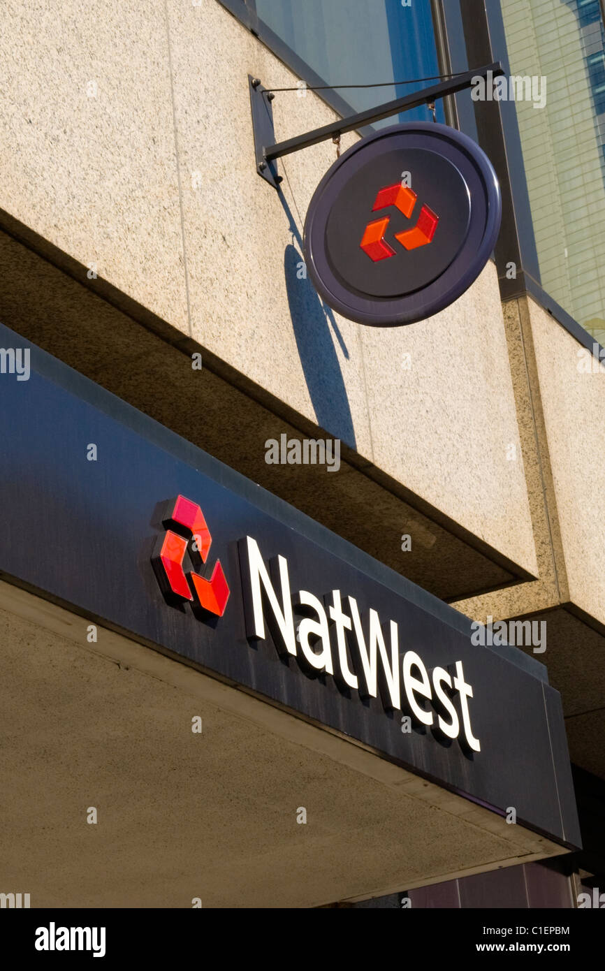 City of London , NatWest or National Westminster retail bank branch - wall & hanging logo or logos sign or signs Stock Photo