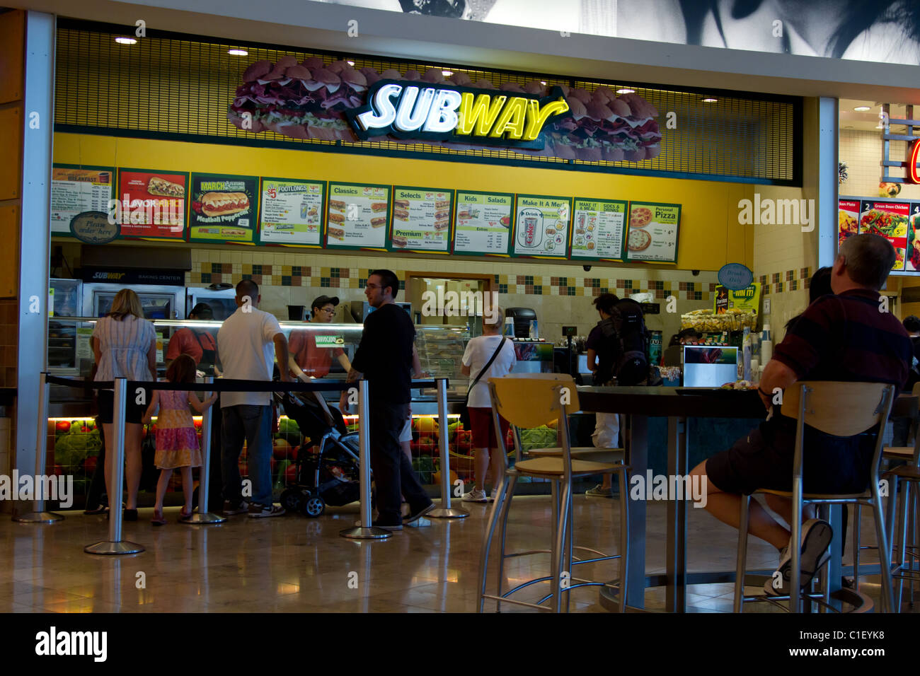 Customer lineup at a subway restaurant in a food court Stock Photo