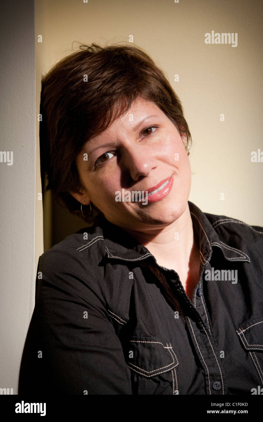 Portrait of a pretty young woman posing for the camera Stock Photo - Alamy