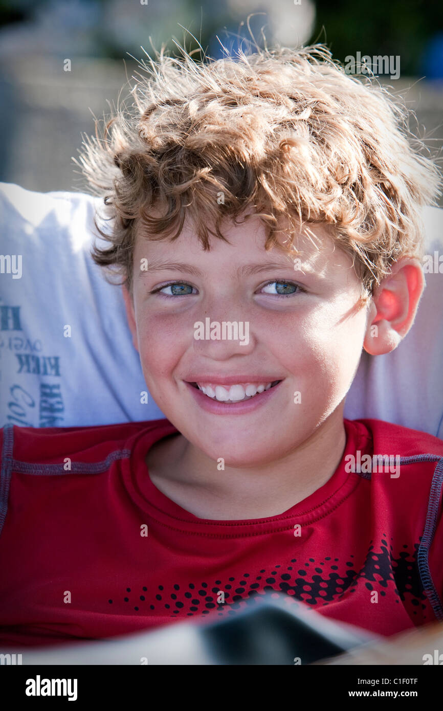 Portrait of a young boy smiling Stock Photo - Alamy
