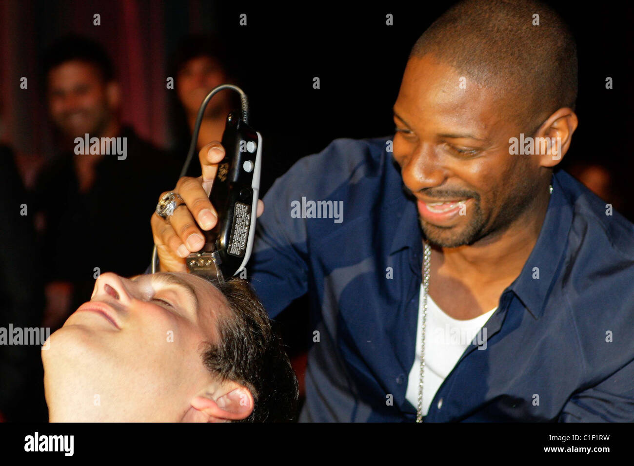 Alan Roth has his hair shaved off to benefit the Cystic Fibrosis Foundation at the Eleventh Annual Fashion Art Ball. DJ Irie Stock Photo