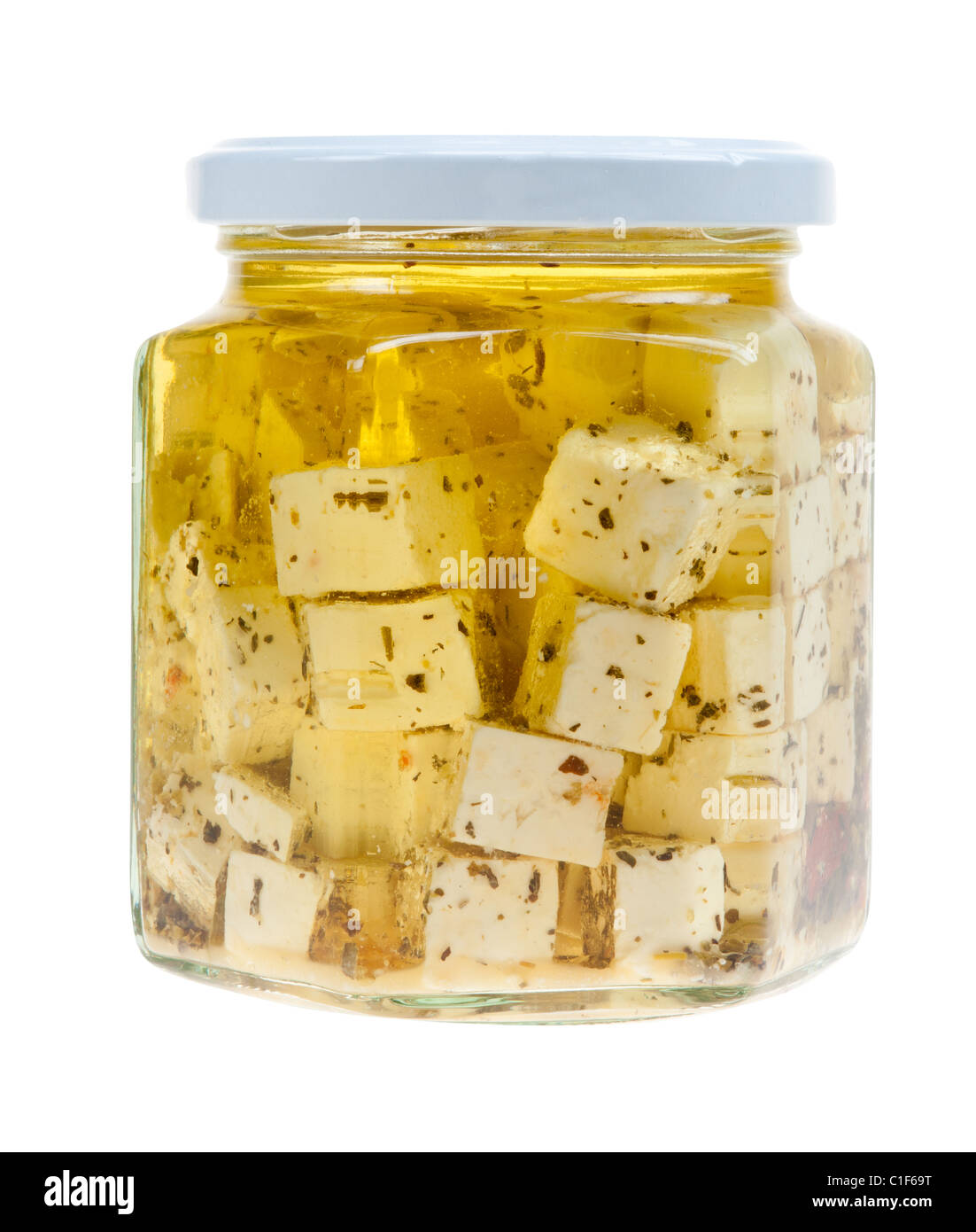 Hirtenkase or herder's cheese with oil in a jar isolated on a white background Stock Photo