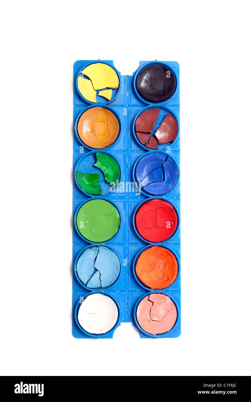 Aging plastic palette with watercolor paint on white background Stock