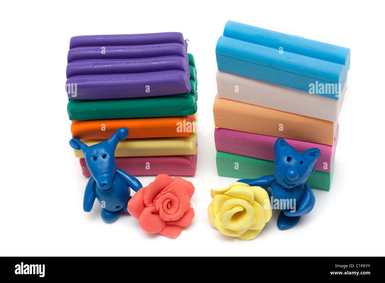Plasticine of the toy and plates, varicoloured homemade articles Stock Photo