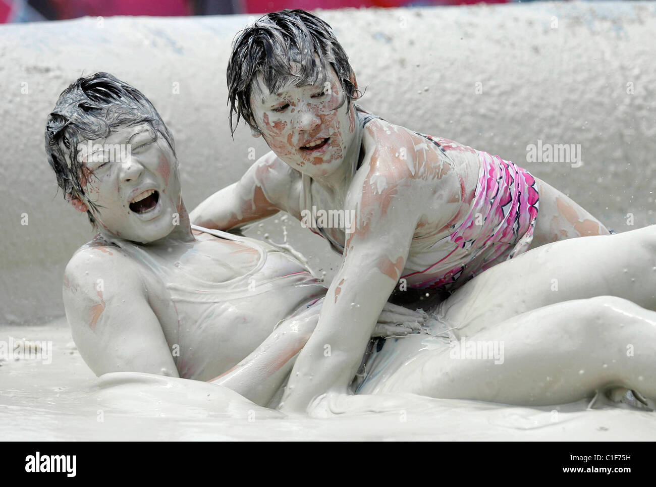 China scoops mud wrestling gold and silver China has dominated the World Mud Wrestling championships in Wuhan China, scooping Stock Photo