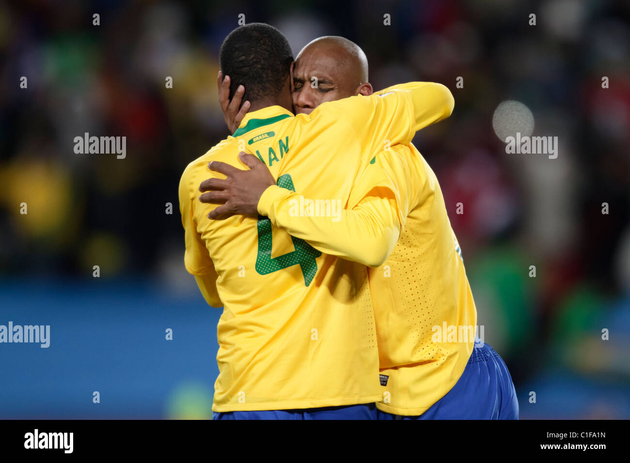 Juan (l) and Maicon (r) of Brazil embrace after Maicon scored a goal against North Korea during a 2010 World Cup football match. Stock Photo