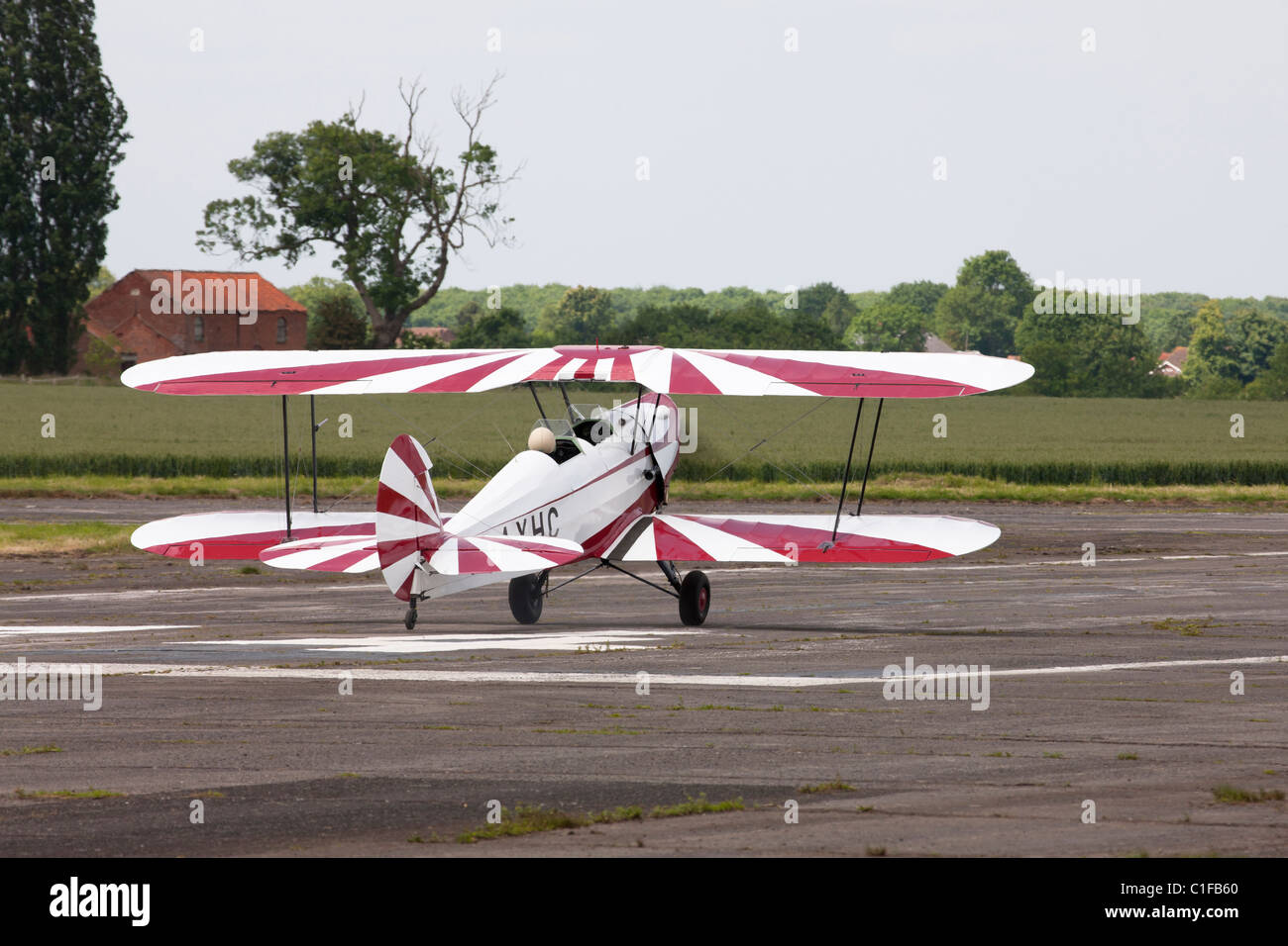 Stampe SV4C G-AXHC taking-ff from runway at Wickenby Airfield Stock Photo