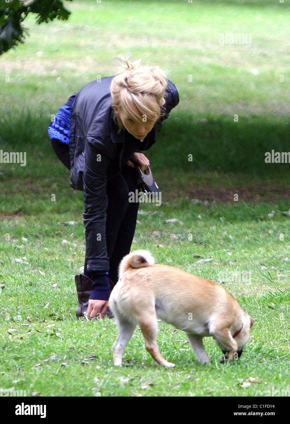Ekaterina Ivanova plays with her dog in the park London, England - 14.05.09 Stock Photo