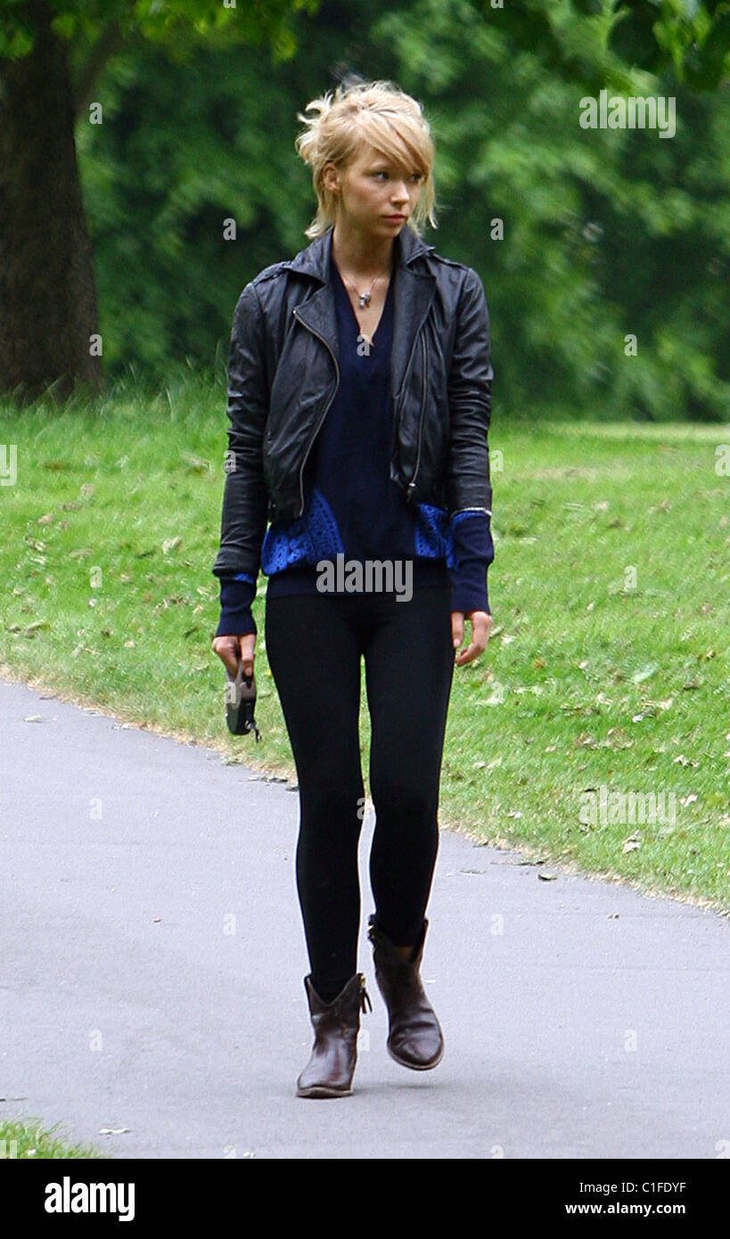 Ekaterina Ivanova plays with her dog in the park London, England - 14.05.09 Stock Photo