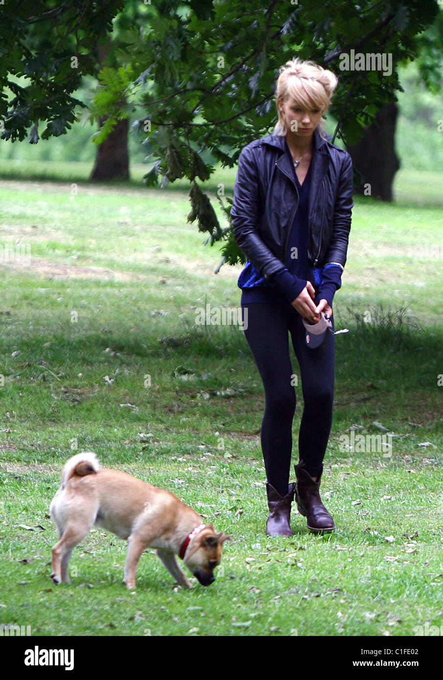 Ekaterina Ivanova plays with her dog in the park London, England - 14.05.09 Stock Photo