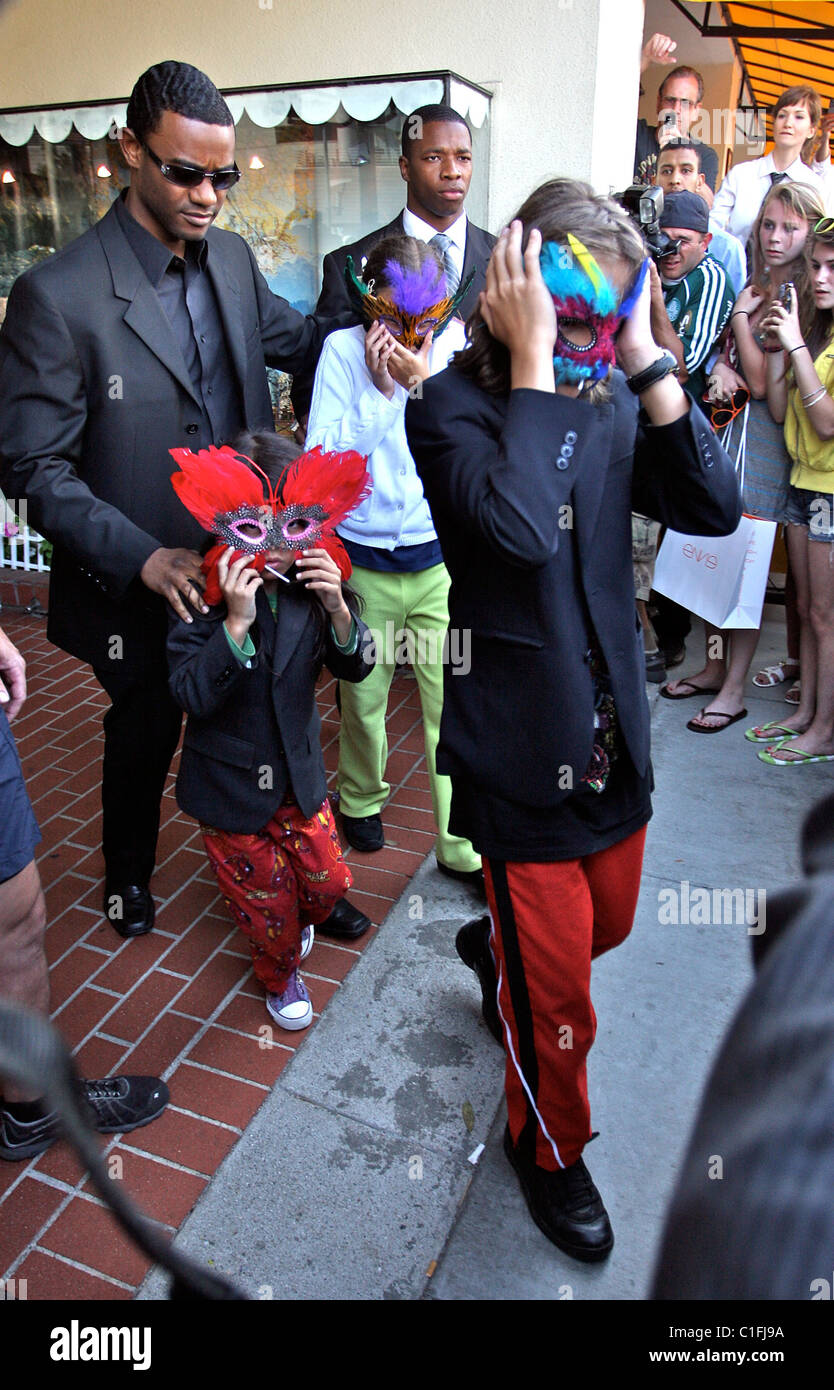 Michael Jackson's children Prince Michael, Prince Michaell II and Paris  wearing their masks leaving Tom's Toys after going on a Stock Photo - Alamy