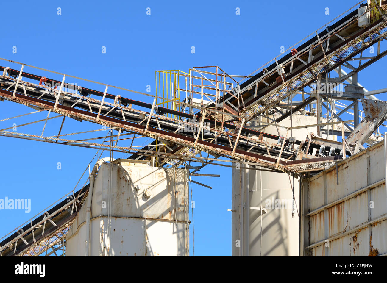 conveyor belts intersecting at a cement plant. Stock Photo