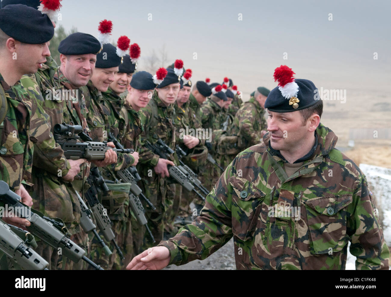 Soldiers from the Territorial Army training weapons being cleared by their  Company Sergeant Major after live firing Stock Photo - Alamy