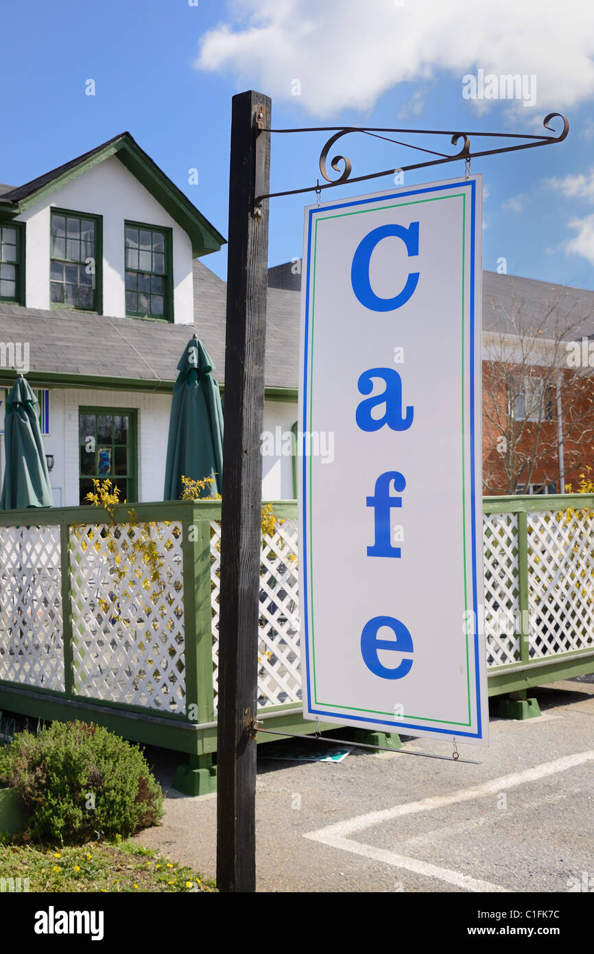 Cafe sign in front of a quaint cafe patio. Stock Photo