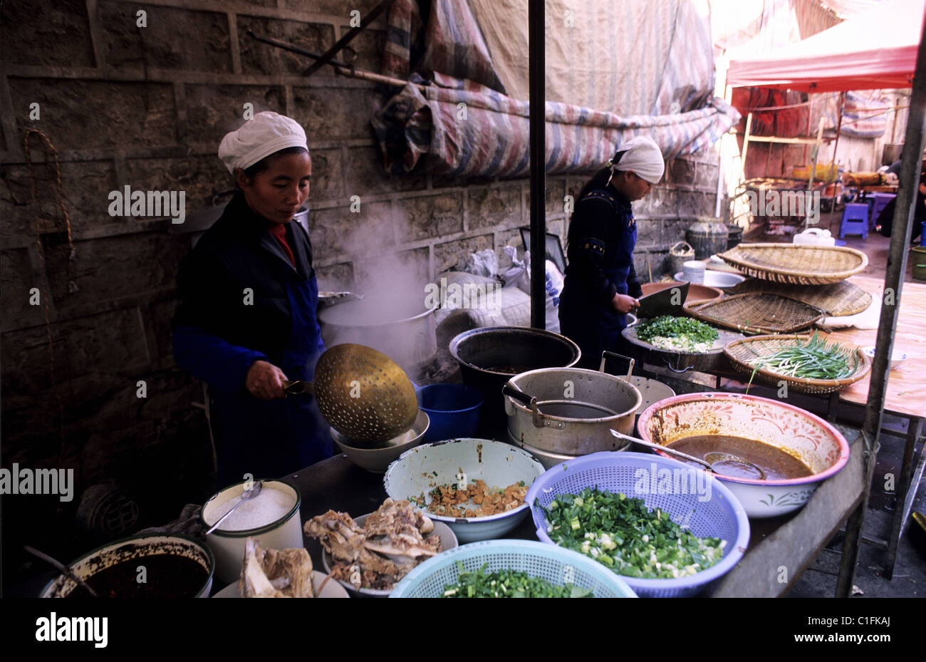 China, Yunnan province, Yuanyang, food stall in the street Stock Photo ...