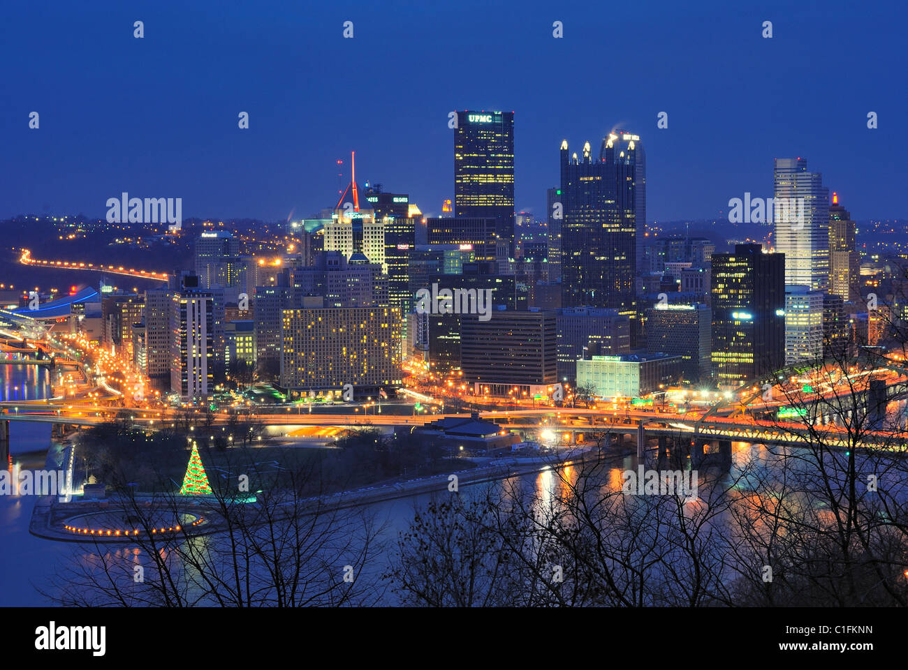 The skyline of Pittsburgh, Pennsylvania, with corporate signs visible atop skyscrapers, visible from Mt. Washington. Stock Photo