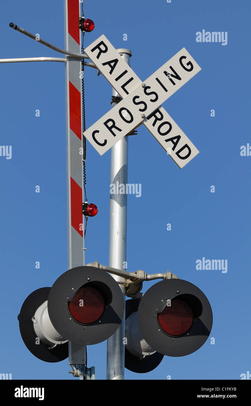 rail road crossing against a blue sky Stock Photo