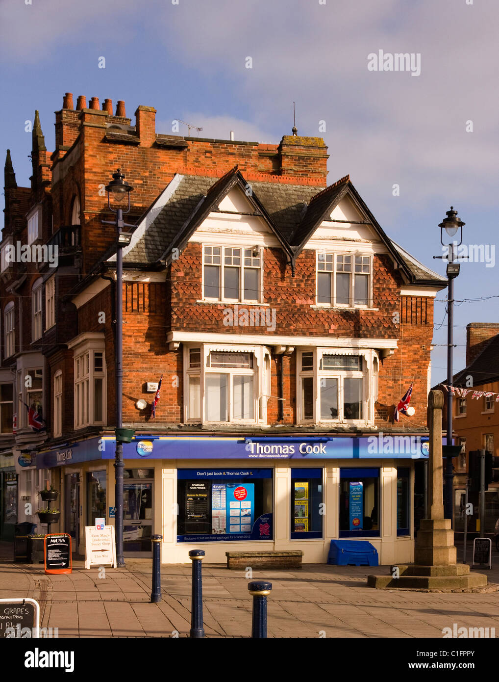 Sunlit Town Centre Shop Front On A Quiet Sunday Afternoon In The Stock Photo Alamy