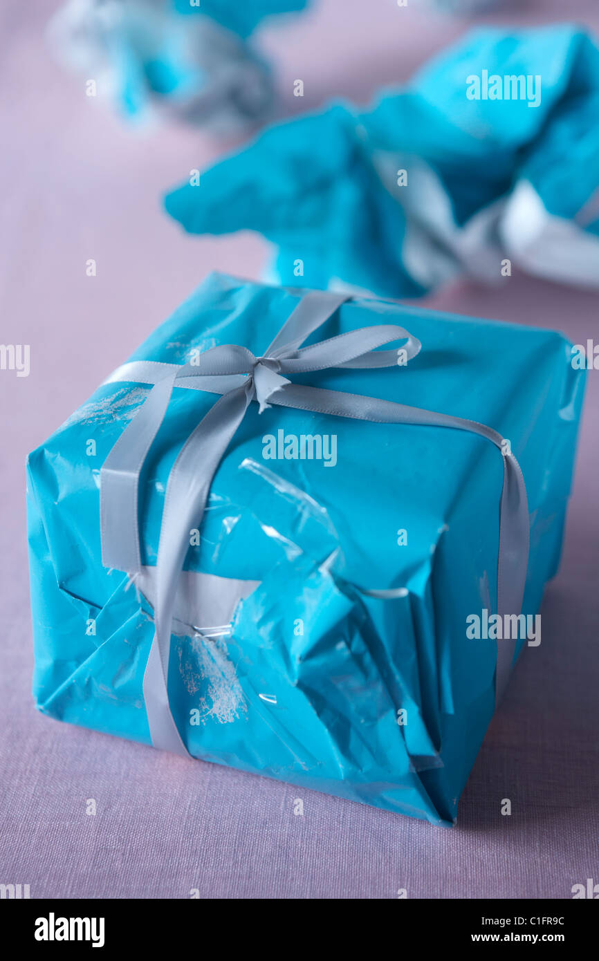 Christmas gift wrapped with wrinkled paper Stock Photo