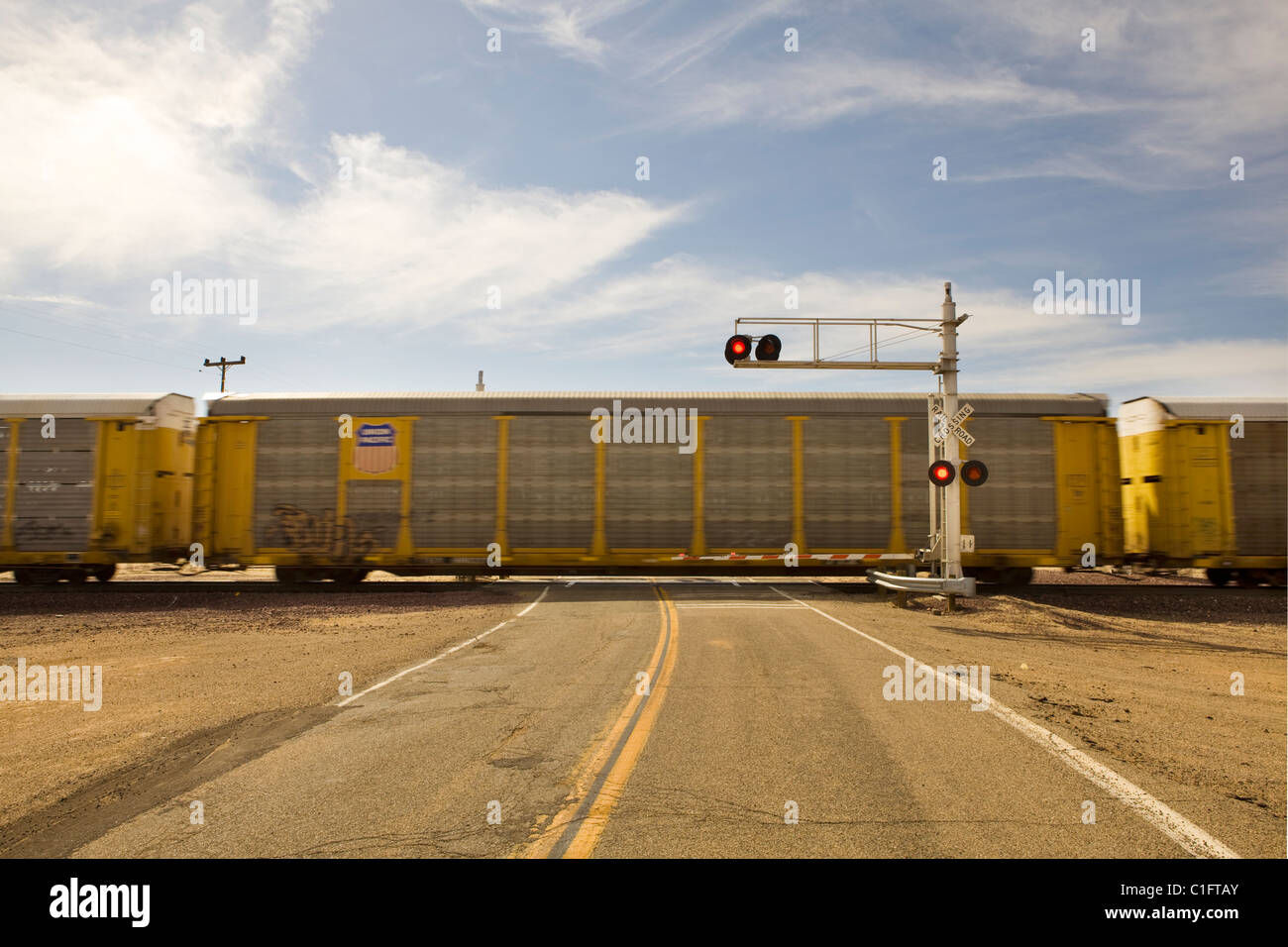 A rural North American train crossing Stock Photo