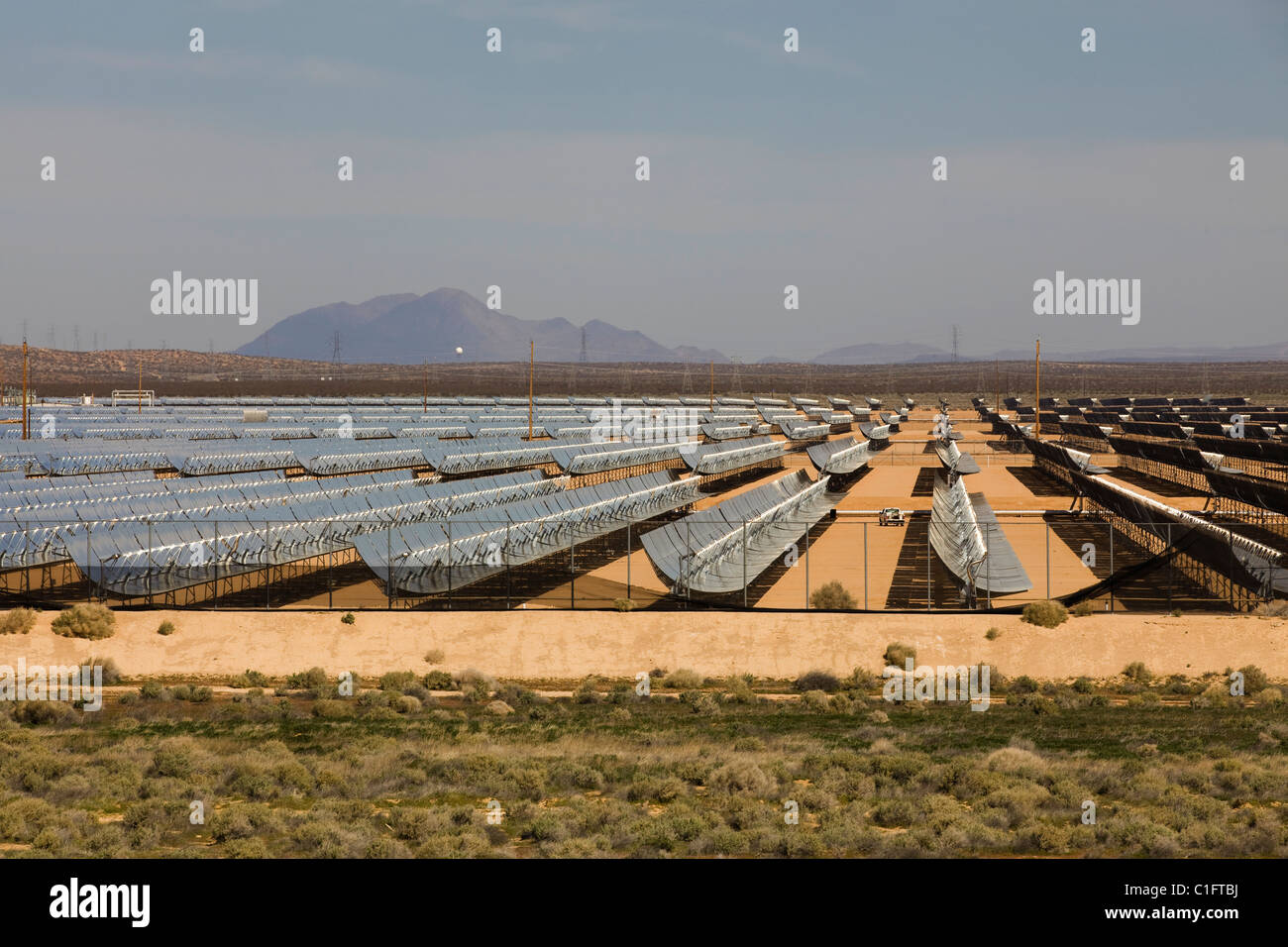 An array of solar troughs in the North American southwest desert - California USA Stock Photo