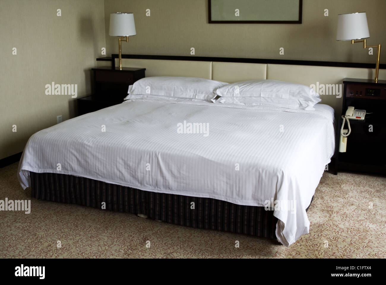 Interior of a hotel room showing a king sized bed Stock Photo Alamy