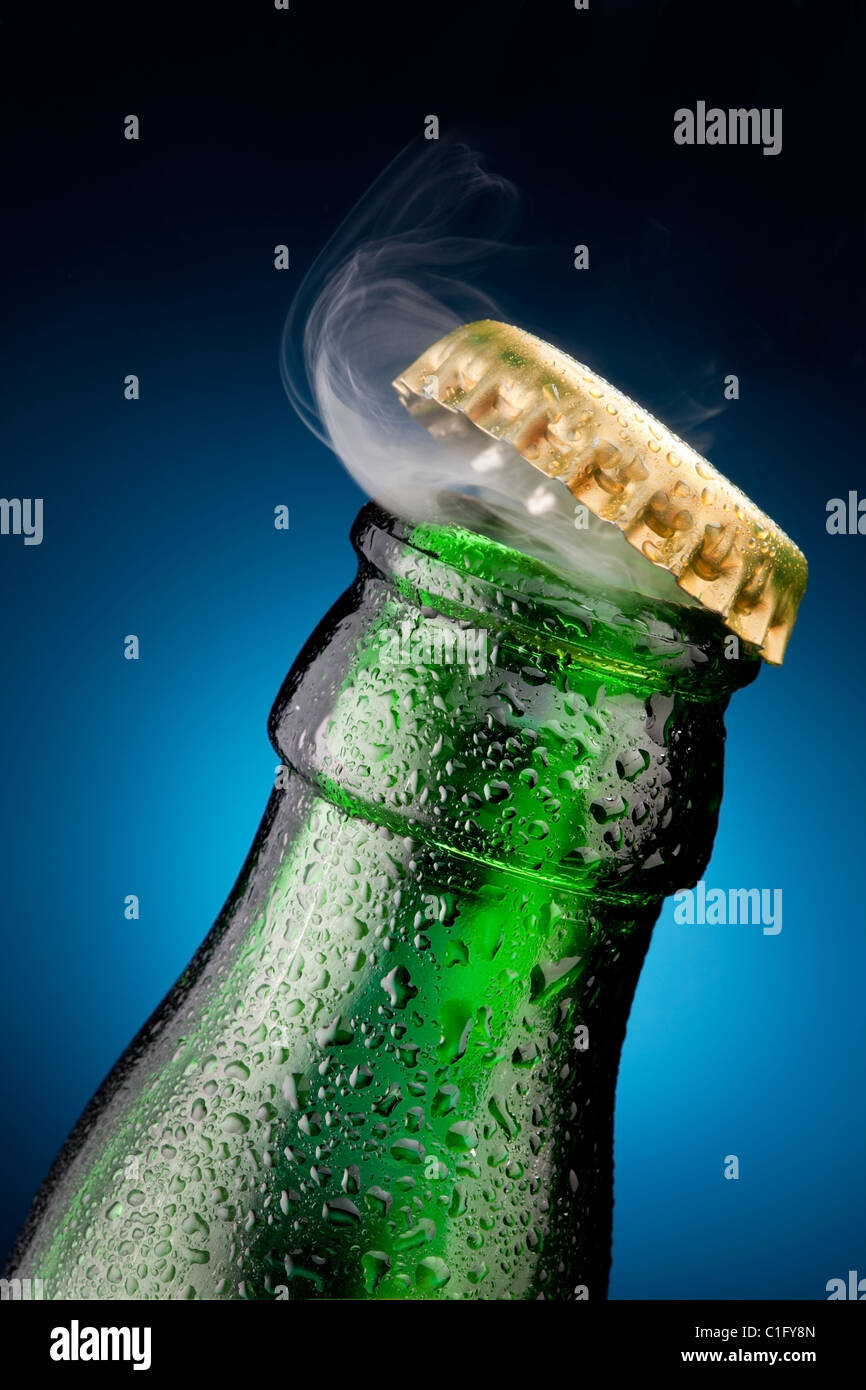 Opening of beer cap with the gas output Stock Photo