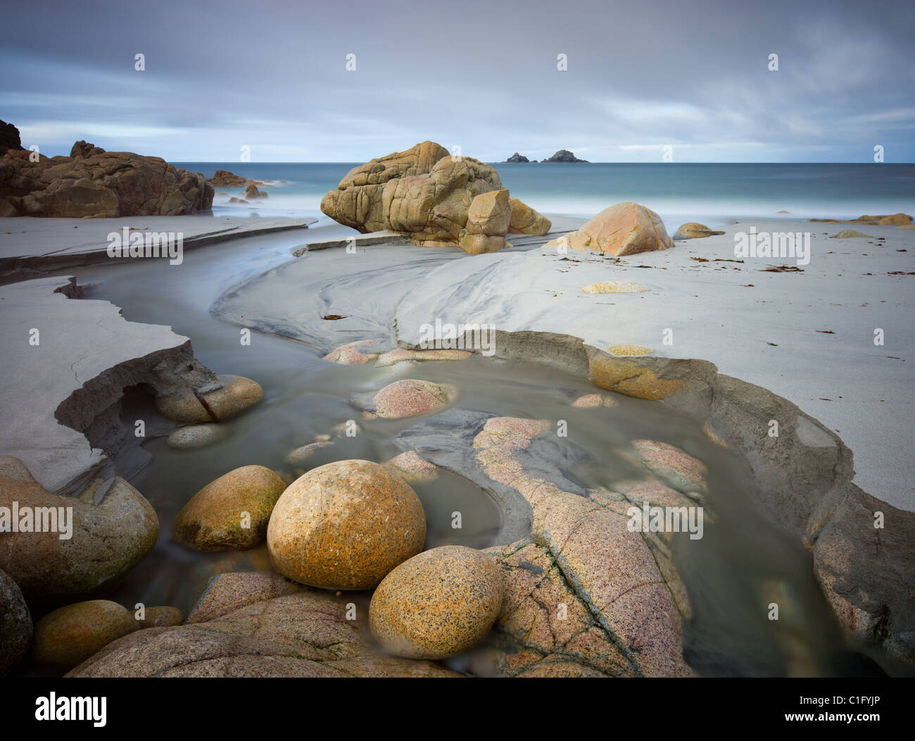 Beautiful boulders on the sandy beach at Porth Nanven near Land's End, Cornwall. Autumn (October) 2010. Stock Photo