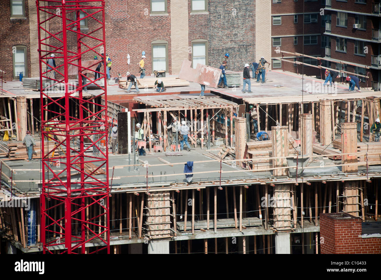 Construction workers building an affordable housing apartment building in the Chelsea
