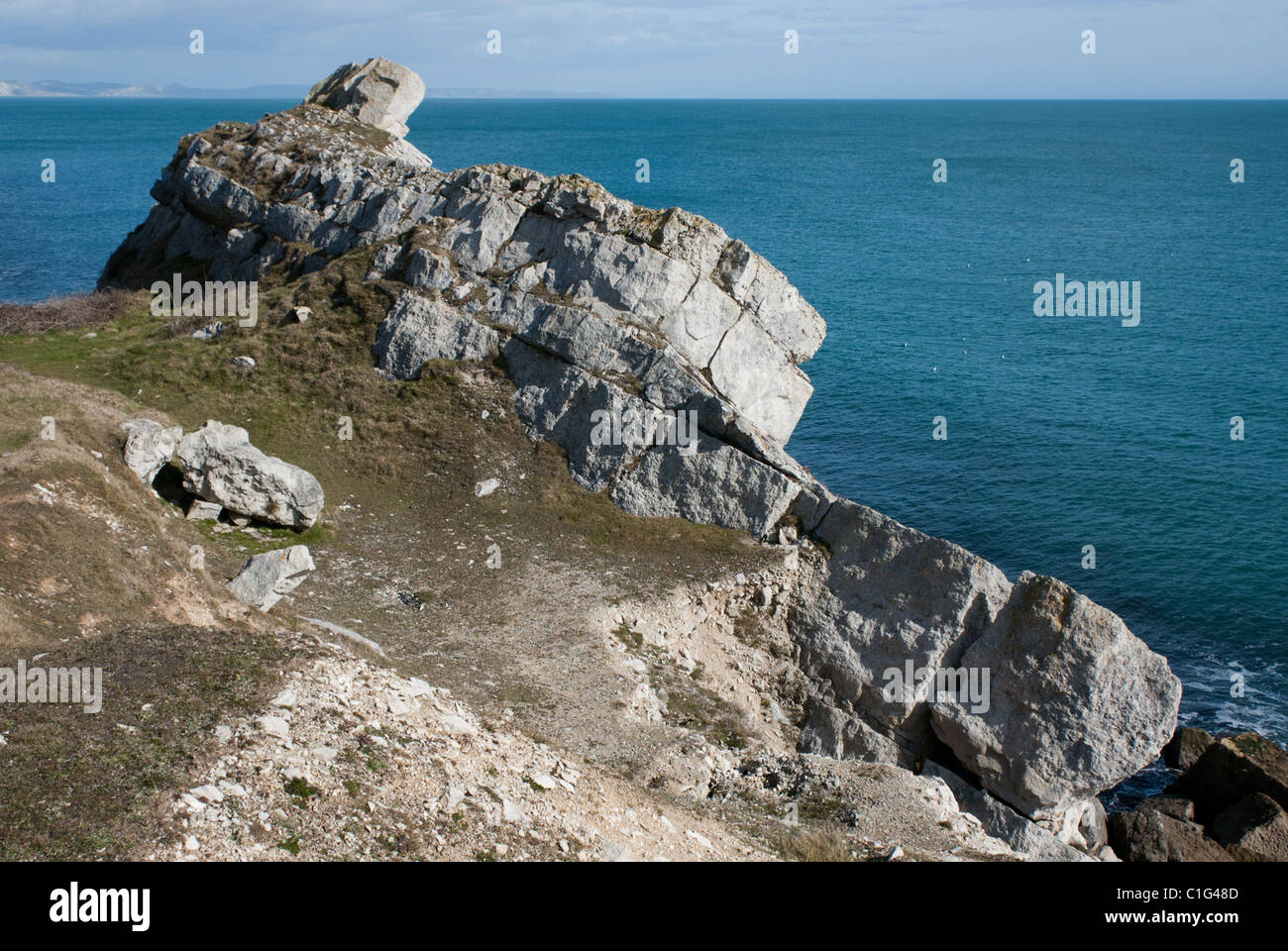 Eroded tilted strata of Portland stone on the coast of Portland in Dorset, UK, that look just like a wrecked or beached ship. Stock Photo