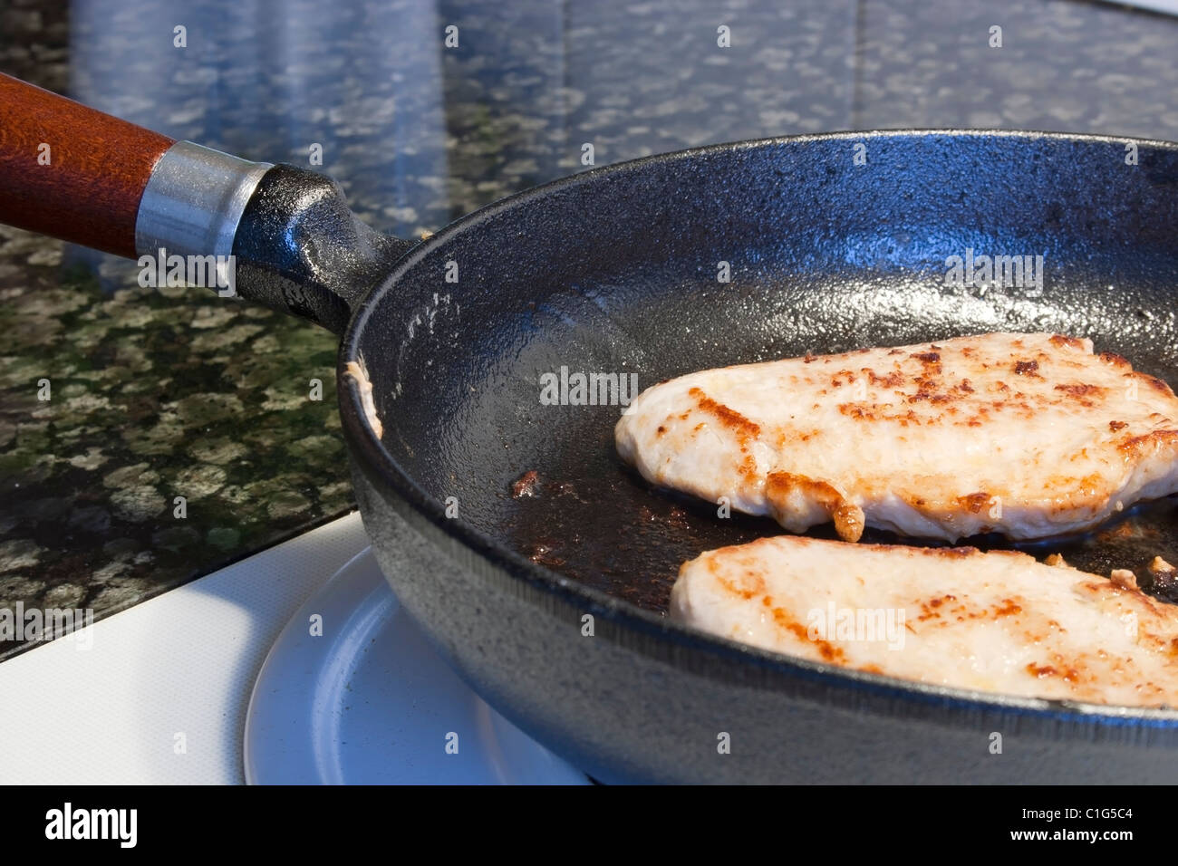 fryingpan on a electric cooker Stock Photo Alamy